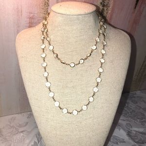 Gold tone wrap necklace with clear CZs